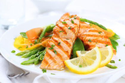 Salmon Platter - (Grilled or blackened) seasoned salmon with lemon and garlic served with hummus.