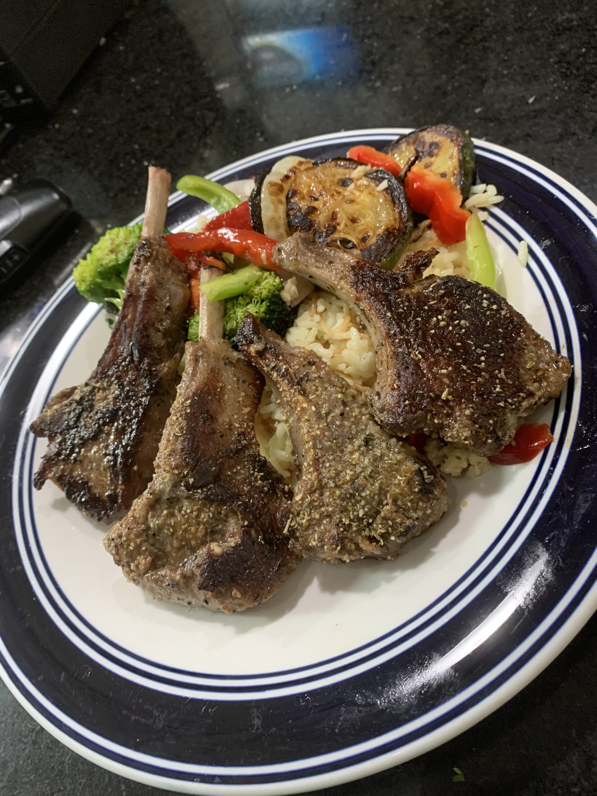 Lamb Chops - Grilled lamb, cooked to your satisfaction. served with middle eastern salad and hummus